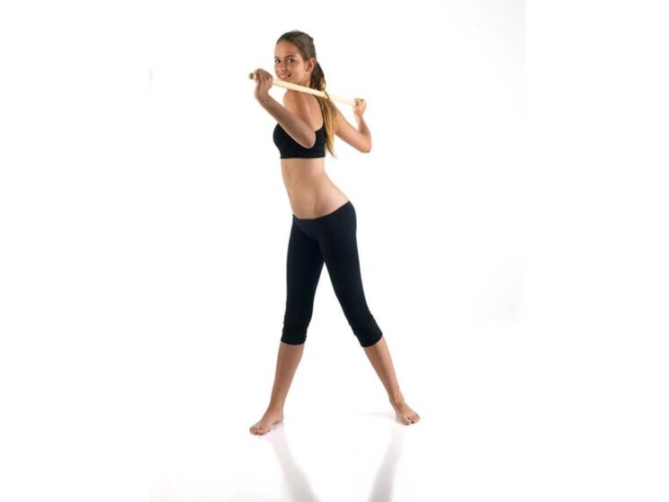 Exercise with a stick to strengthen and develop back muscles with thoracic osteochondrosis